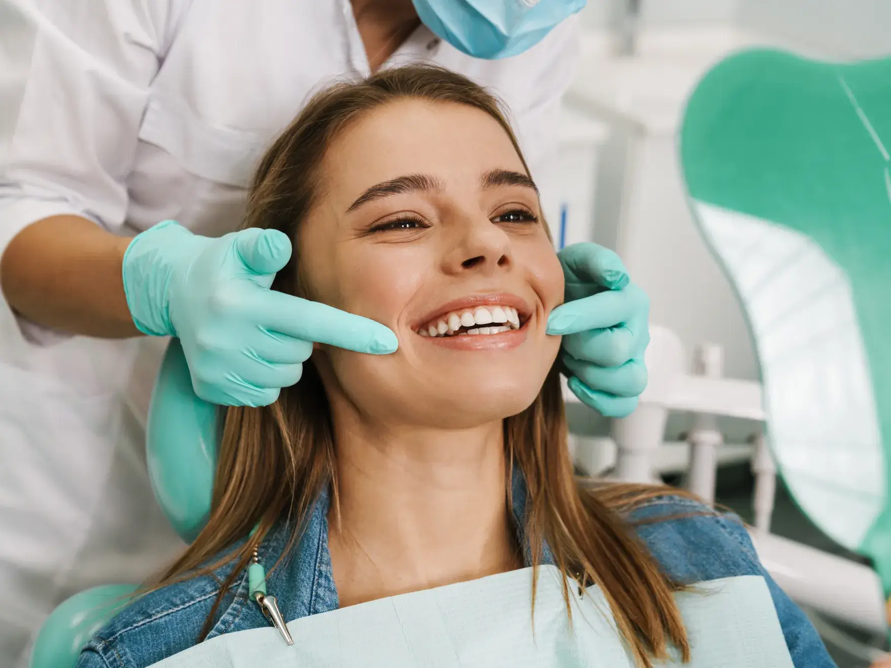 Patient in dental chair smiling